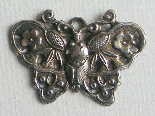 Garment ornament in the shape of a butterfly – (8649)